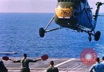 Standbild US Marine Corps UH 34D Hubschrauber landet auf Deck Cape Canaveral Florida USA, 1962, aus Sekunde 23 historischem Filmmaterial Videoclip 65675024593