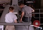 Image of astronauts in procedure trainer United States USA, 1960, second 52 stock footage video 65675024629