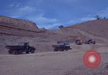 Image of dump trucks Vietnam, 1965, second 7 stock footage video 65675024801