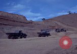 Image of dump trucks Vietnam, 1965, second 8 stock footage video 65675024801