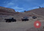 Image of dump trucks Vietnam, 1965, second 9 stock footage video 65675024801