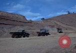 Image of dump trucks Vietnam, 1965, second 10 stock footage video 65675024801