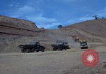 Image of dump trucks Vietnam, 1965, second 12 stock footage video 65675024801