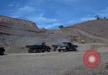 Image of dump trucks Vietnam, 1965, second 15 stock footage video 65675024801