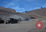 Image of dump trucks Vietnam, 1965, second 17 stock footage video 65675024801