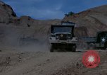 Image of dump trucks Vietnam, 1965, second 20 stock footage video 65675024801