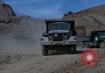 Image of dump trucks Vietnam, 1965, second 21 stock footage video 65675024801