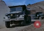 Image of dump trucks Vietnam, 1965, second 22 stock footage video 65675024801