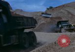 Image of dump trucks Vietnam, 1965, second 23 stock footage video 65675024801