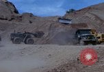 Image of dump trucks Vietnam, 1965, second 24 stock footage video 65675024801
