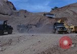 Image of dump trucks Vietnam, 1965, second 26 stock footage video 65675024801