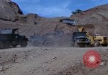 Image of dump trucks Vietnam, 1965, second 27 stock footage video 65675024801