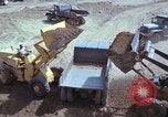 Image of dump trucks Vietnam, 1965, second 30 stock footage video 65675024801