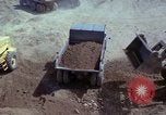 Image of dump trucks Vietnam, 1965, second 40 stock footage video 65675024801