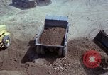 Image of dump trucks Vietnam, 1965, second 41 stock footage video 65675024801