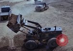 Image of dump trucks Vietnam, 1965, second 42 stock footage video 65675024801