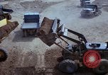 Image of dump trucks Vietnam, 1965, second 45 stock footage video 65675024801