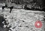 Image of long boats navigate rapids Japan, 1898, second 5 stock footage video 65675024930