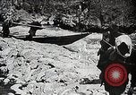 Image of long boats navigate rapids Japan, 1898, second 18 stock footage video 65675024930
