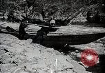 Image of long boats navigate rapids Japan, 1898, second 24 stock footage video 65675024930