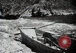 Image of long boats navigate rapids Japan, 1898, second 34 stock footage video 65675024930