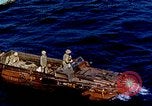 Image of U.S. wounded transported by boat from Okinawa battlefield Pacific Ocean, 1945, second 1 stock footage video 65675024978