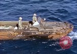 Image of U.S. wounded transported by boat from Okinawa battlefield Pacific Ocean, 1945, second 8 stock footage video 65675024978