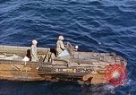 Image of U.S. wounded transported by boat from Okinawa battlefield Pacific Ocean, 1945, second 9 stock footage video 65675024978