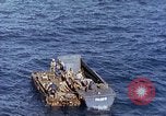 Image of U.S. wounded transported by boat from Okinawa battlefield Pacific Ocean, 1945, second 21 stock footage video 65675024978
