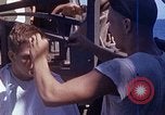 Standbild USA sailor getting a haircut an Bord seines Schiffes im Pazifischen Ozean Pazifik, 1945, aus Sekunde 8 historischem Filmmaterial Videoclip 65675024980