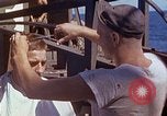 Standbild USA sailor getting a haircut an Bord seines Schiffes im Pazifischen Ozean Pazifik, 1945, aus Sekunde 12 historischem Filmmaterial Videoclip 65675024980