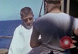 Standbild USA sailor getting a haircut an Bord seines Schiffes im Pazifischen Ozean Pazifik, 1945, aus Sekunde 41 historischem Filmmaterial Videoclip 65675024980