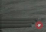 Standbild American naval Bombardierung Peleliu Palau, 1944, aus Sekunde 61 historischem Filmmaterial Videoclip 65675024982