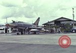 Image of Vietnamese contractor personnel clean F-100D airplane Vietnam, 1966, second 1 stock footage video 65675024991
