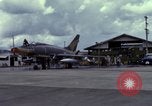 Image of Vietnamese contractor personnel clean F-100D airplane Vietnam, 1966, second 4 stock footage video 65675024991