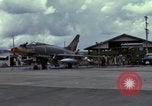 Image of Vietnamese contractor personnel clean F-100D airplane Vietnam, 1966, second 11 stock footage video 65675024991