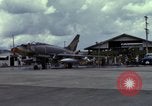 Image of Vietnamese contractor personnel clean F-100D airplane Vietnam, 1966, second 14 stock footage video 65675024991