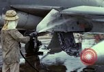 Image of Vietnamese contractor personnel clean F-100D airplane Vietnam, 1966, second 16 stock footage video 65675024991
