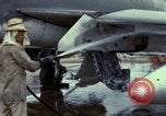 Image of Vietnamese contractor personnel clean F-100D airplane Vietnam, 1966, second 17 stock footage video 65675024991