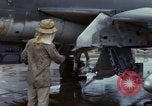 Image of Vietnamese contractor personnel clean F-100D airplane Vietnam, 1966, second 21 stock footage video 65675024991