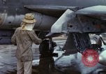 Image of Vietnamese contractor personnel clean F-100D airplane Vietnam, 1966, second 24 stock footage video 65675024991