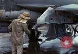 Image of Vietnamese contractor personnel clean F-100D airplane Vietnam, 1966, second 25 stock footage video 65675024991
