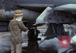 Image of Vietnamese contractor personnel clean F-100D airplane Vietnam, 1966, second 26 stock footage video 65675024991