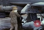 Image of Vietnamese contractor personnel clean F-100D airplane Vietnam, 1966, second 27 stock footage video 65675024991