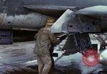 Image of Vietnamese contractor personnel clean F-100D airplane Vietnam, 1966, second 28 stock footage video 65675024991