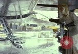 Image of Vietnamese contractor personnel clean F-100D airplane Vietnam, 1966, second 30 stock footage video 65675024991