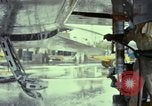 Image of Vietnamese contractor personnel clean F-100D airplane Vietnam, 1966, second 32 stock footage video 65675024991
