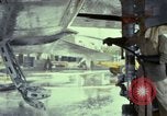 Image of Vietnamese contractor personnel clean F-100D airplane Vietnam, 1966, second 33 stock footage video 65675024991