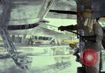 Image of Vietnamese contractor personnel clean F-100D airplane Vietnam, 1966, second 34 stock footage video 65675024991