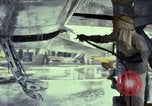 Image of Vietnamese contractor personnel clean F-100D airplane Vietnam, 1966, second 35 stock footage video 65675024991